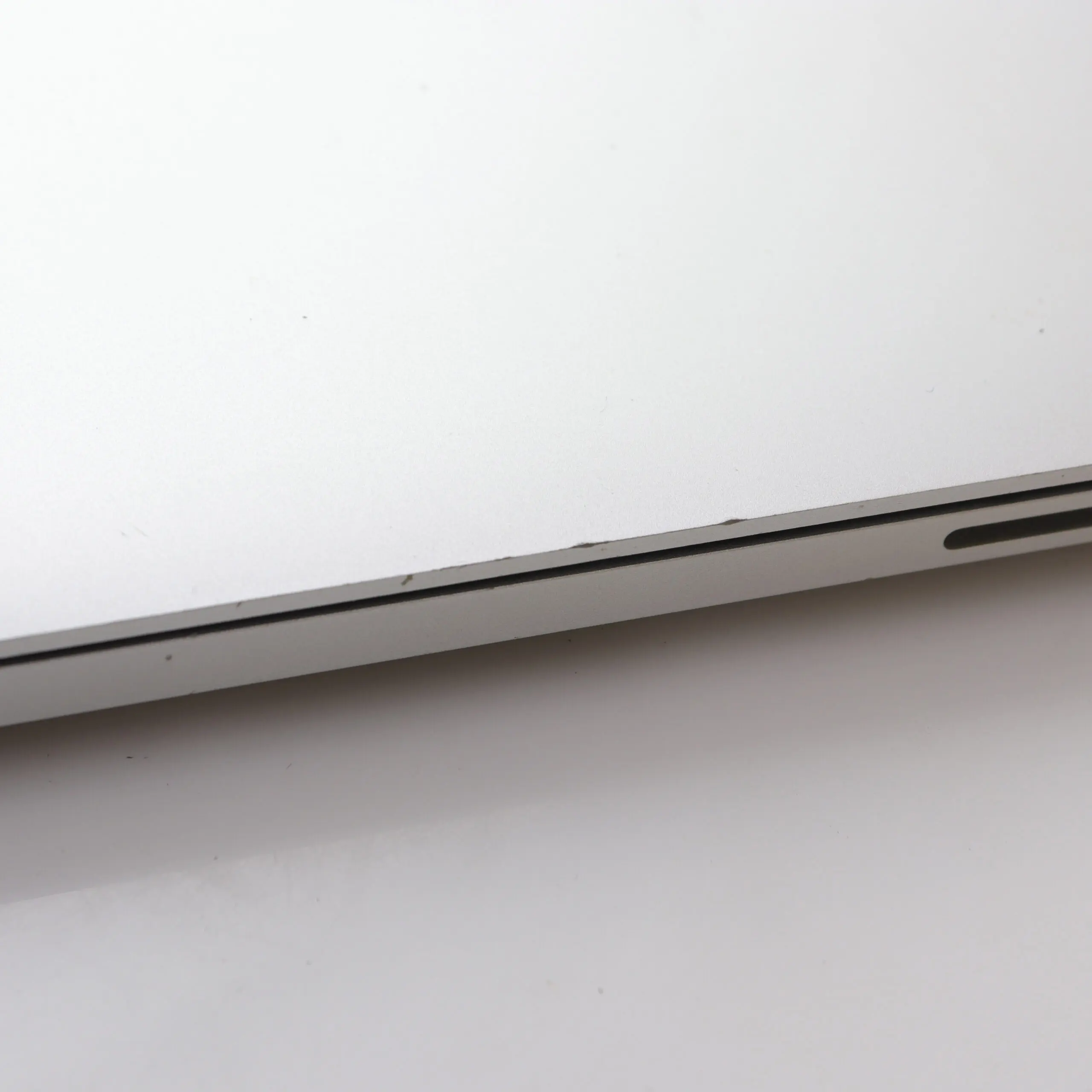 MacBook with worn edge