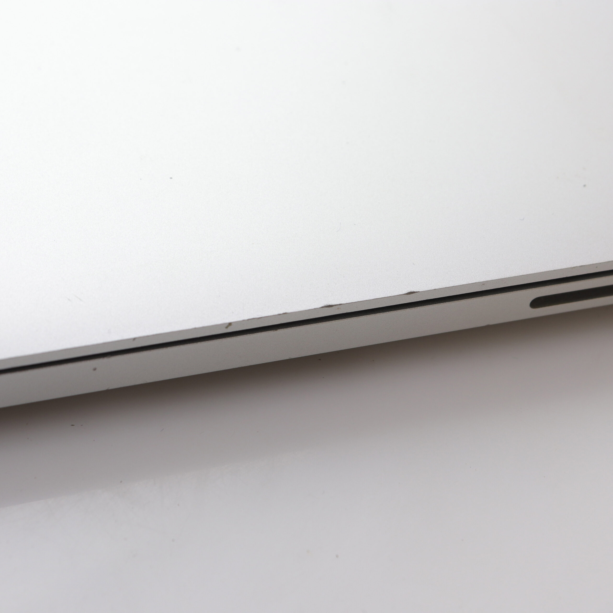 MacBook with worn edge